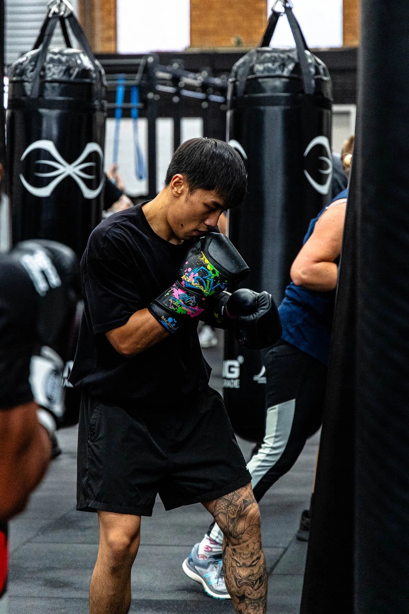 A member in a tight guard between the heavy bags